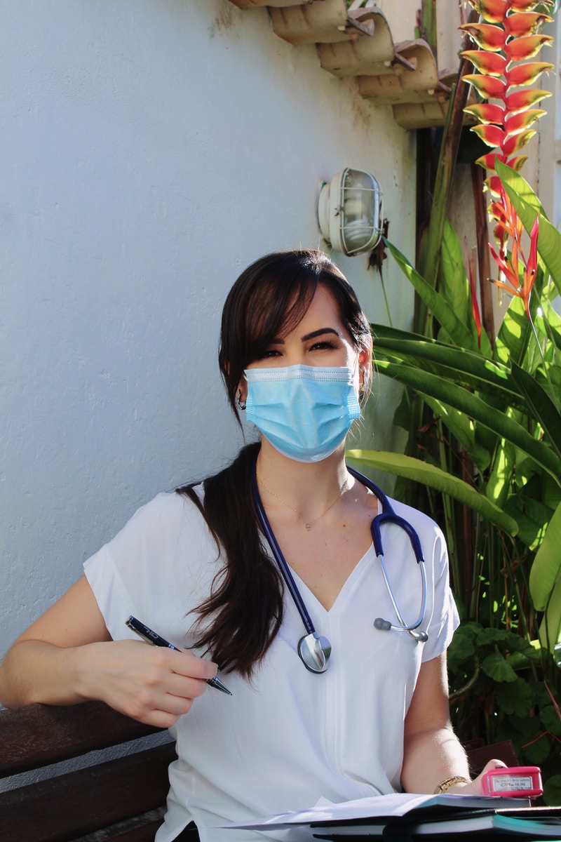 a night shift nurse smiling wearing a mask