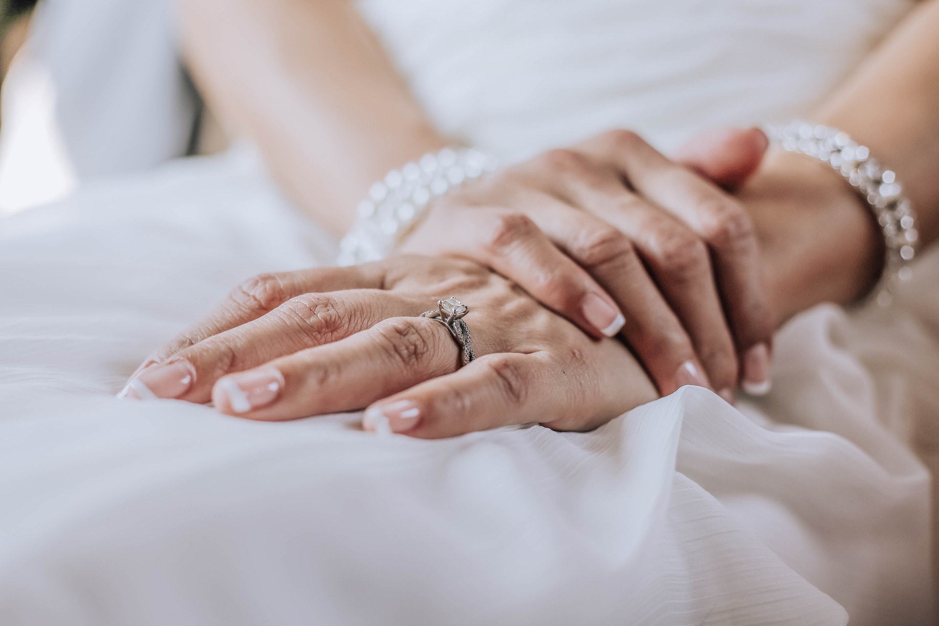 A hand of a girl with a handmade ring on the finger 