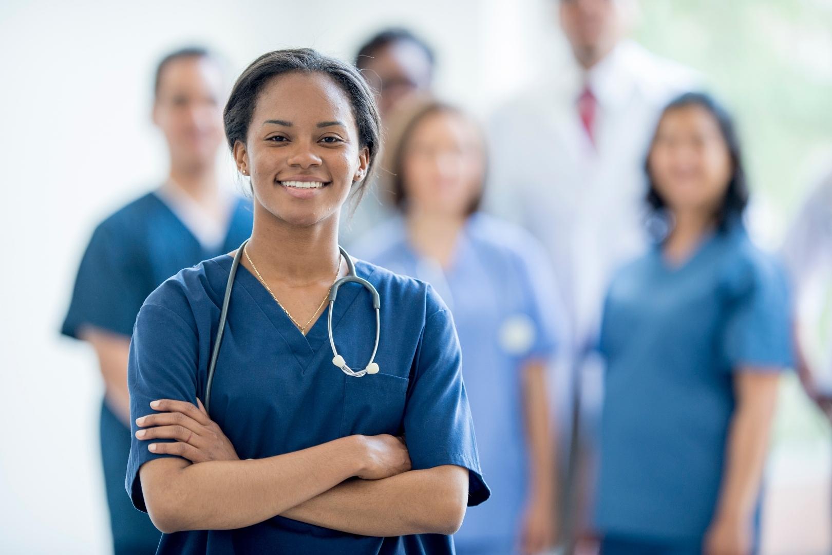 Happy nurses in blue